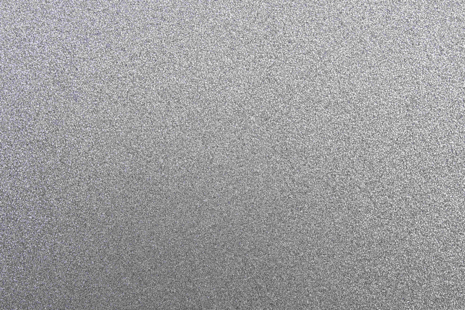 帶有細微閃亮紋理和柔和漸變的銀色金屬表面。