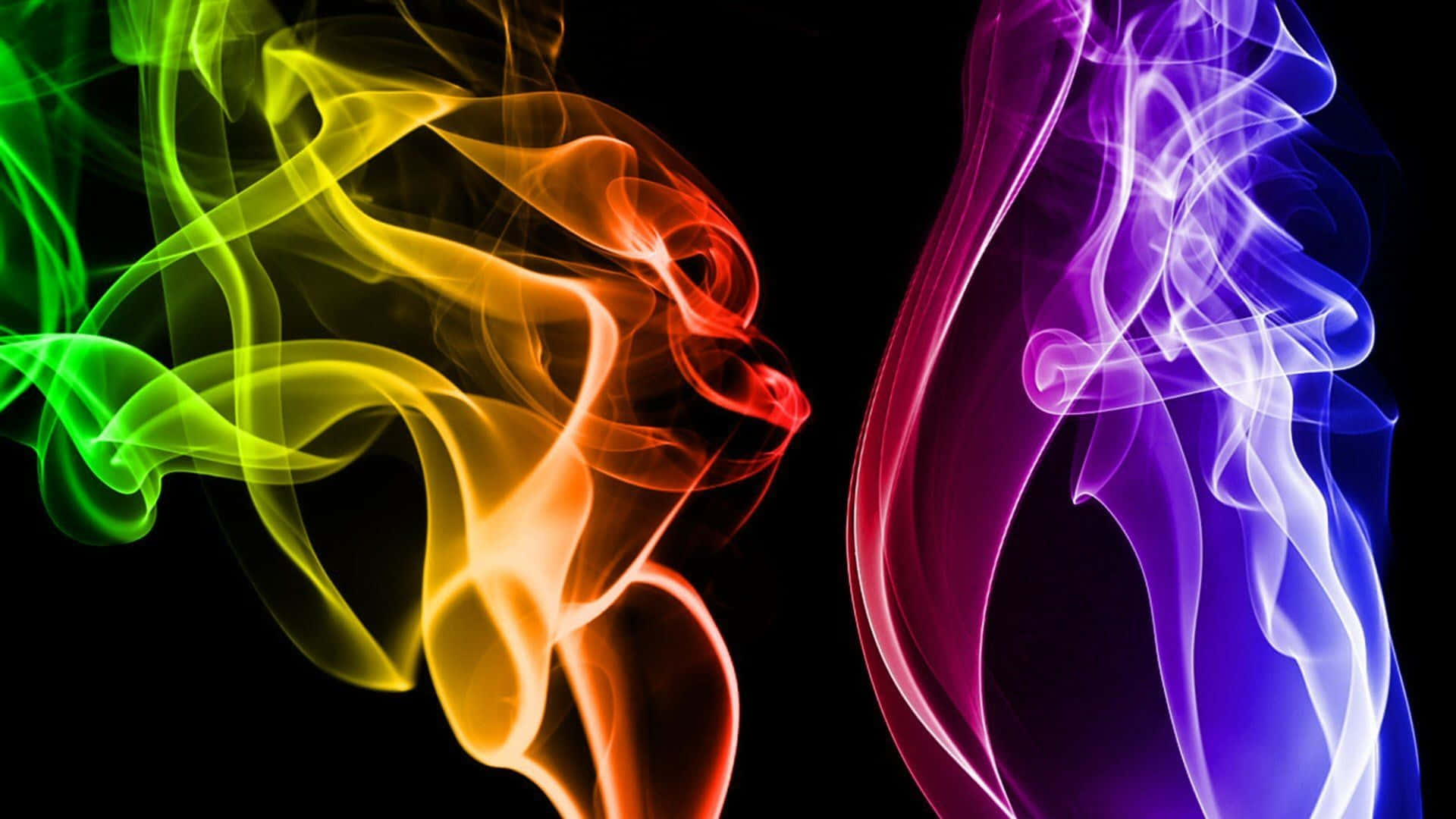 色彩繽紛的煙霧流在黑色背景上優雅地流動。