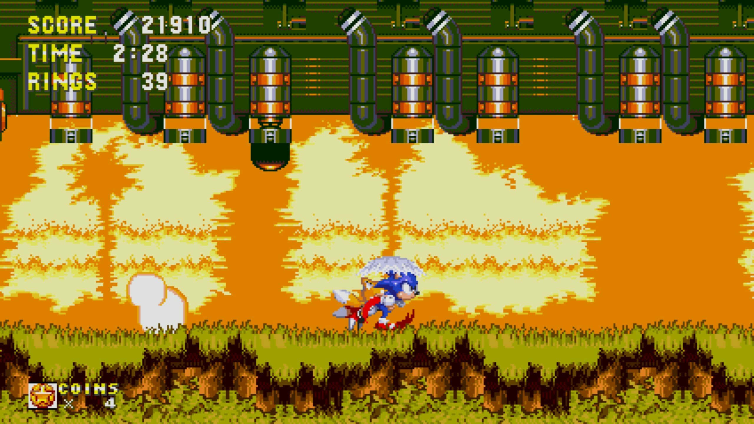 Sonic Oil Ocean Zone 桌布 壁紙 — 經典16位元音速小子跑過一個熾熱的沙漠關卡，頭頂有管道，遊戲HUD元素可見。