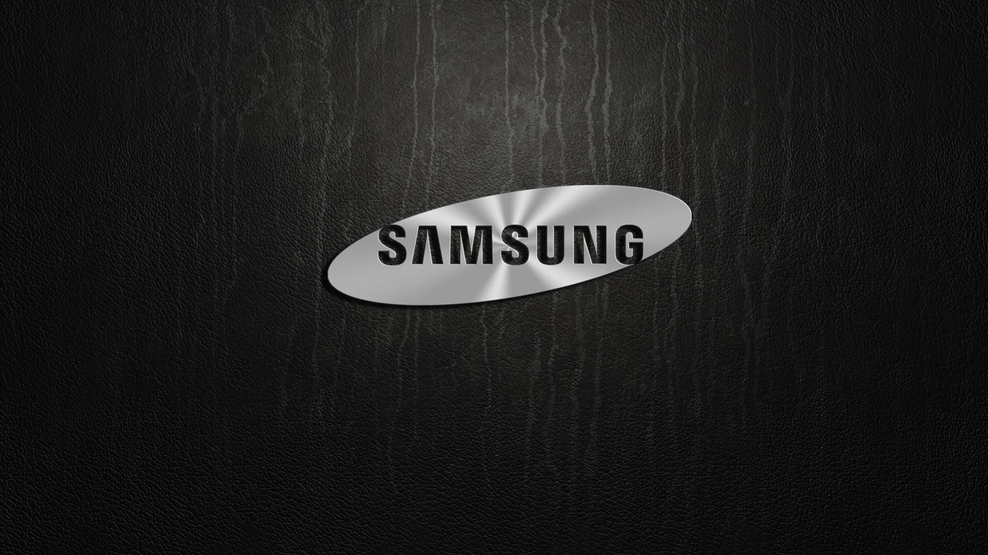 黑色皮革背景上帶有金屬光澤的Samsung標誌