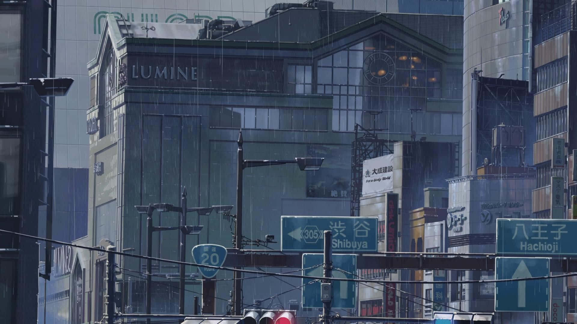 灰色天空下，帶有澀谷招牌和現代建築的雨東京街道。
