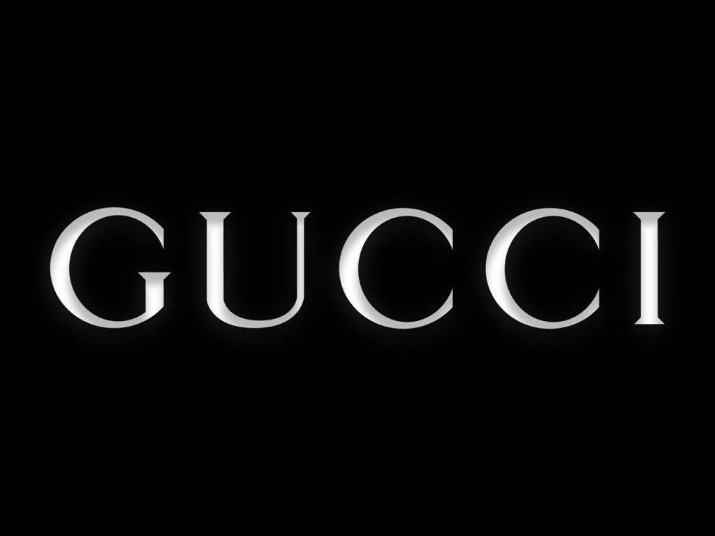 黑色背景上的銀色 Gucci 標誌