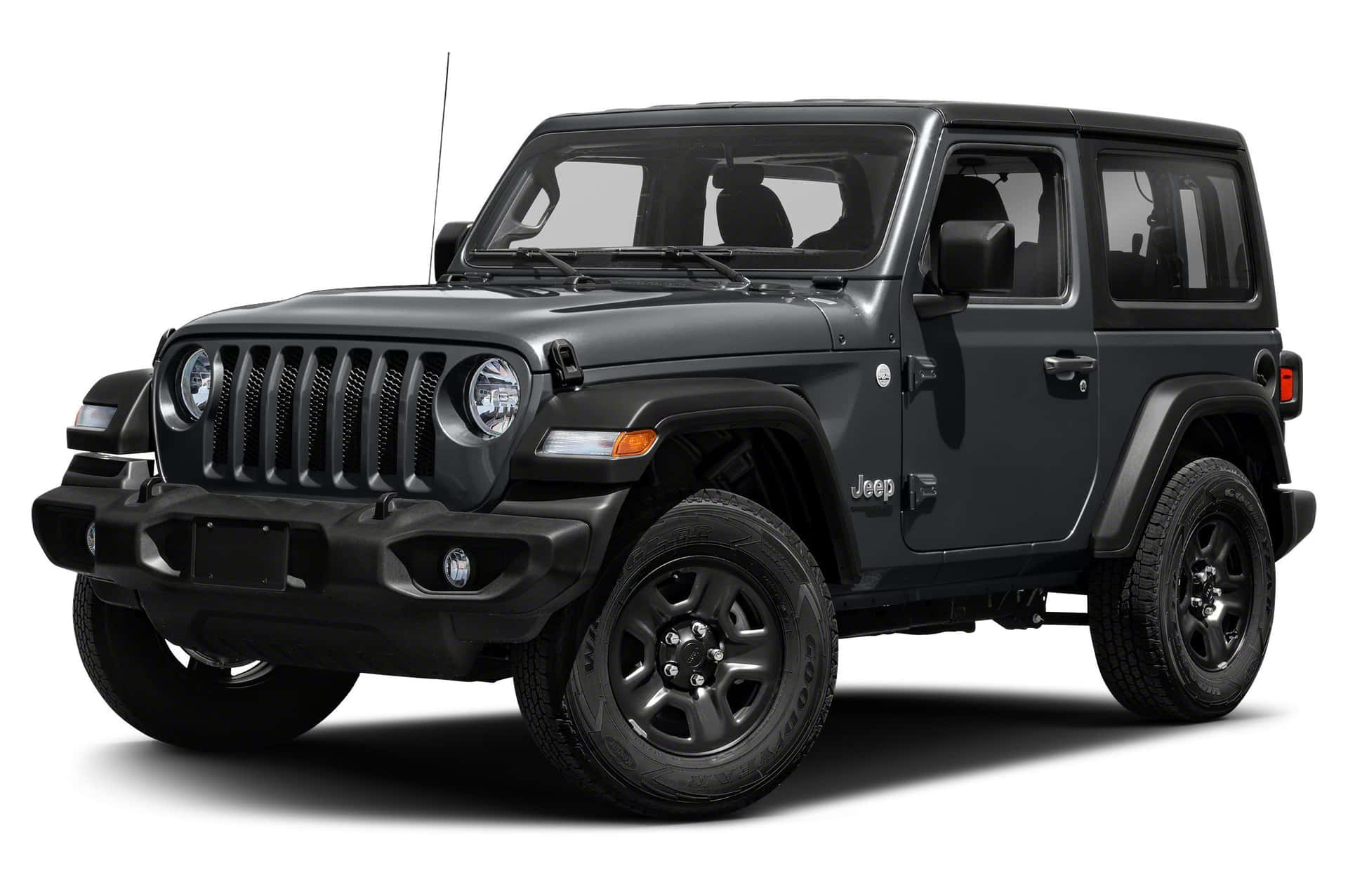 啞光黑色Jeep Wrangler SUV 攝影棚拍攝，堅固設計，輪胎可見