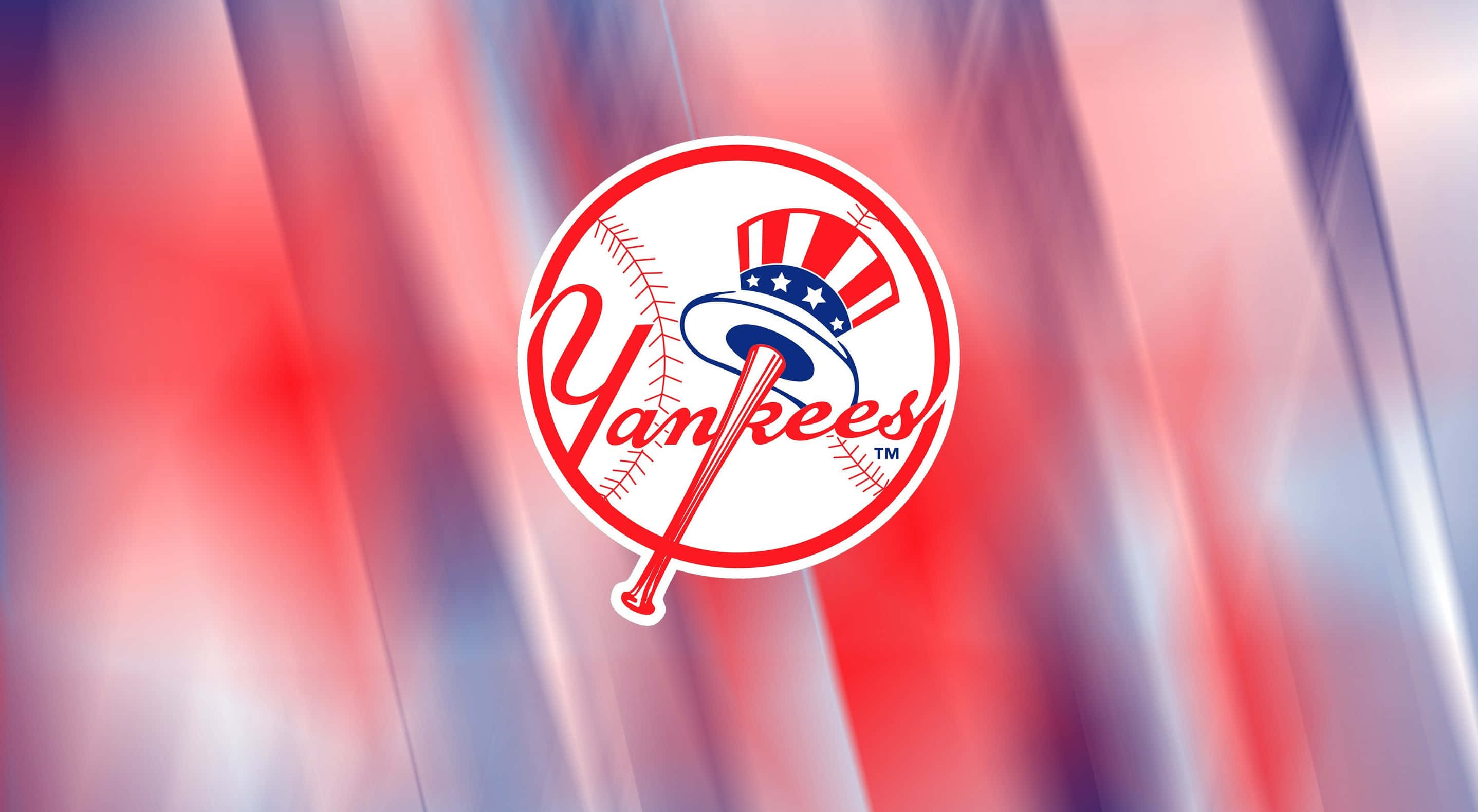 Yankees 桌布 壁紙 — 經典紐約洋基標誌居中於動態紅白藍模糊背景上。