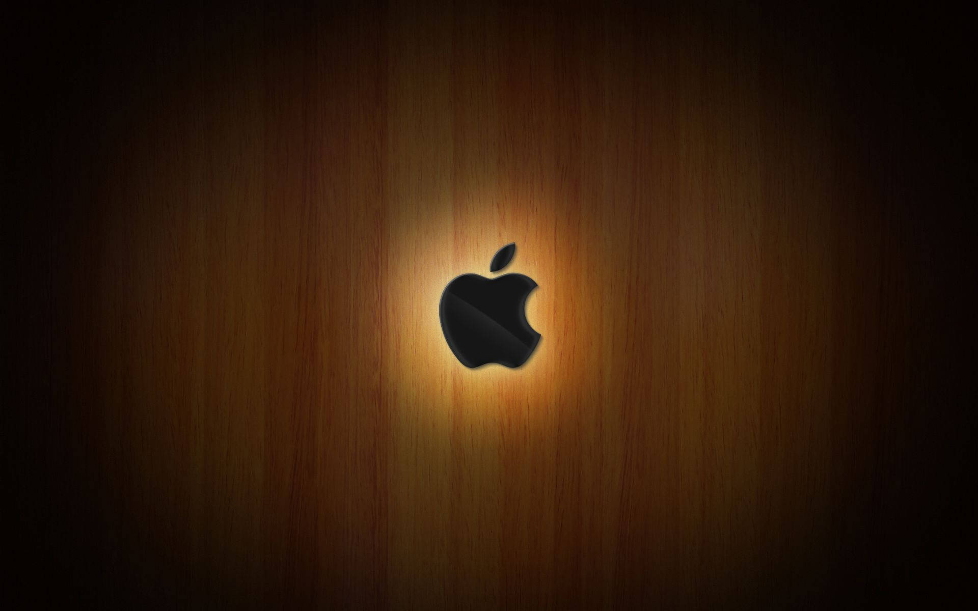 黑色Apple標誌在木質表面上發光