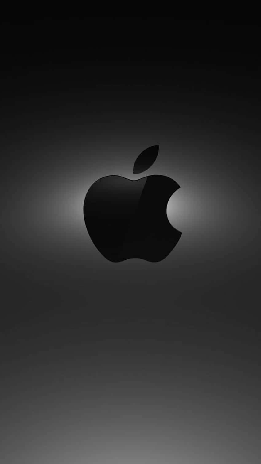 黑色Apple標誌在深灰色漸變背景上柔和發光。