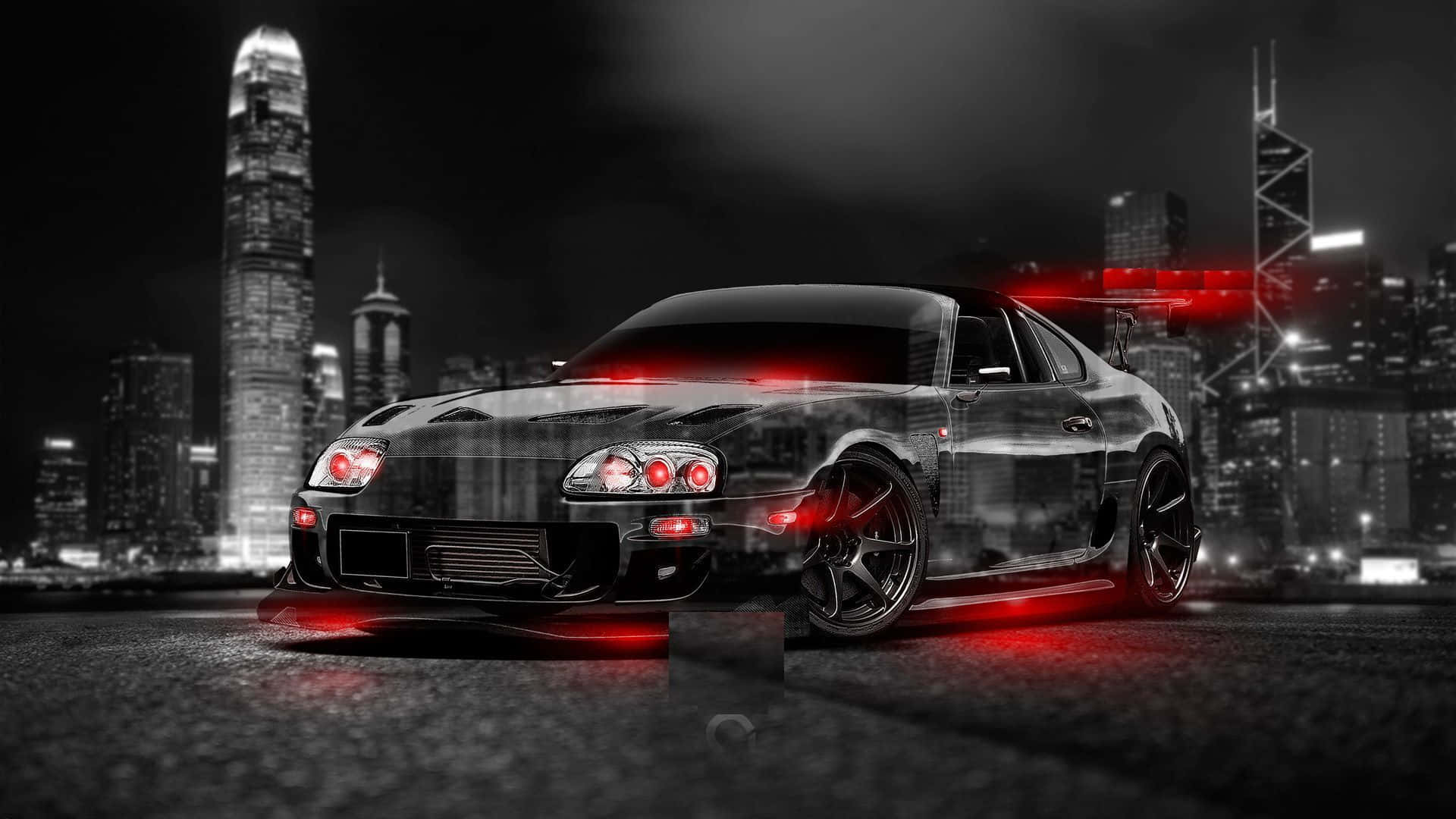 黑色跑車帶有紅色燈光，夜間停放在城市天際線前。