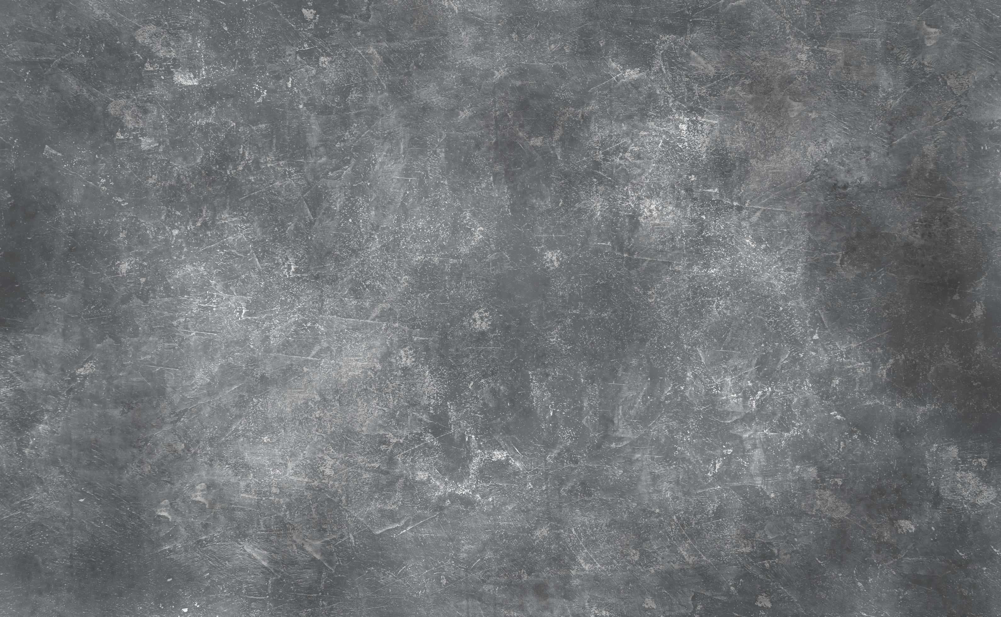 Aesthetic Gray 桌布 壁紙 — 經風化的灰色混凝土表面，帶有細微刮痕以及白色和深灰色的斑點。