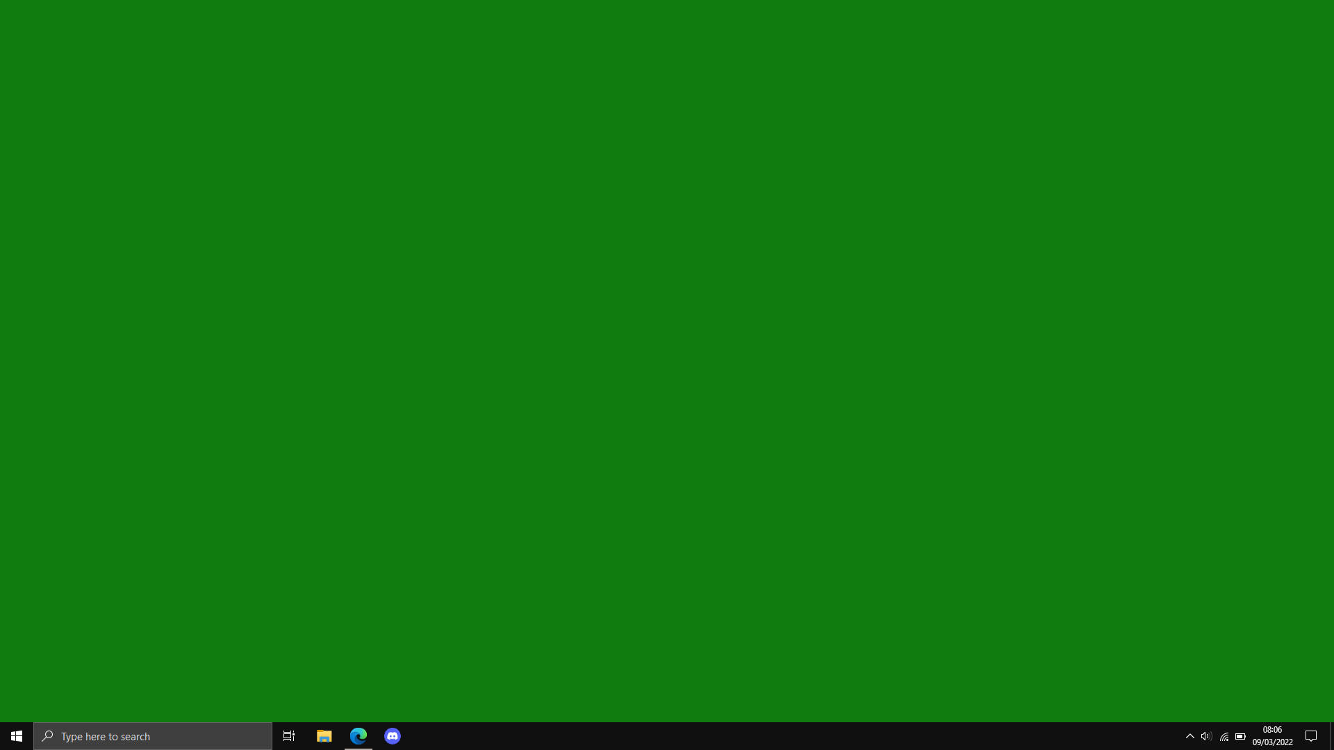帶有綠色背景和工作列的 Windows 電腦螢幕