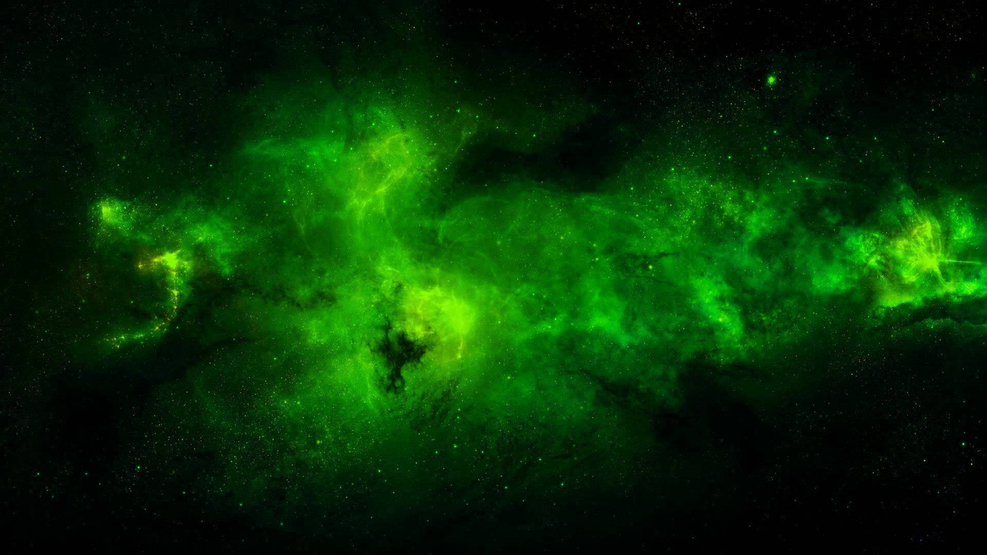 深空中散佈著星星的發光綠色星雲。