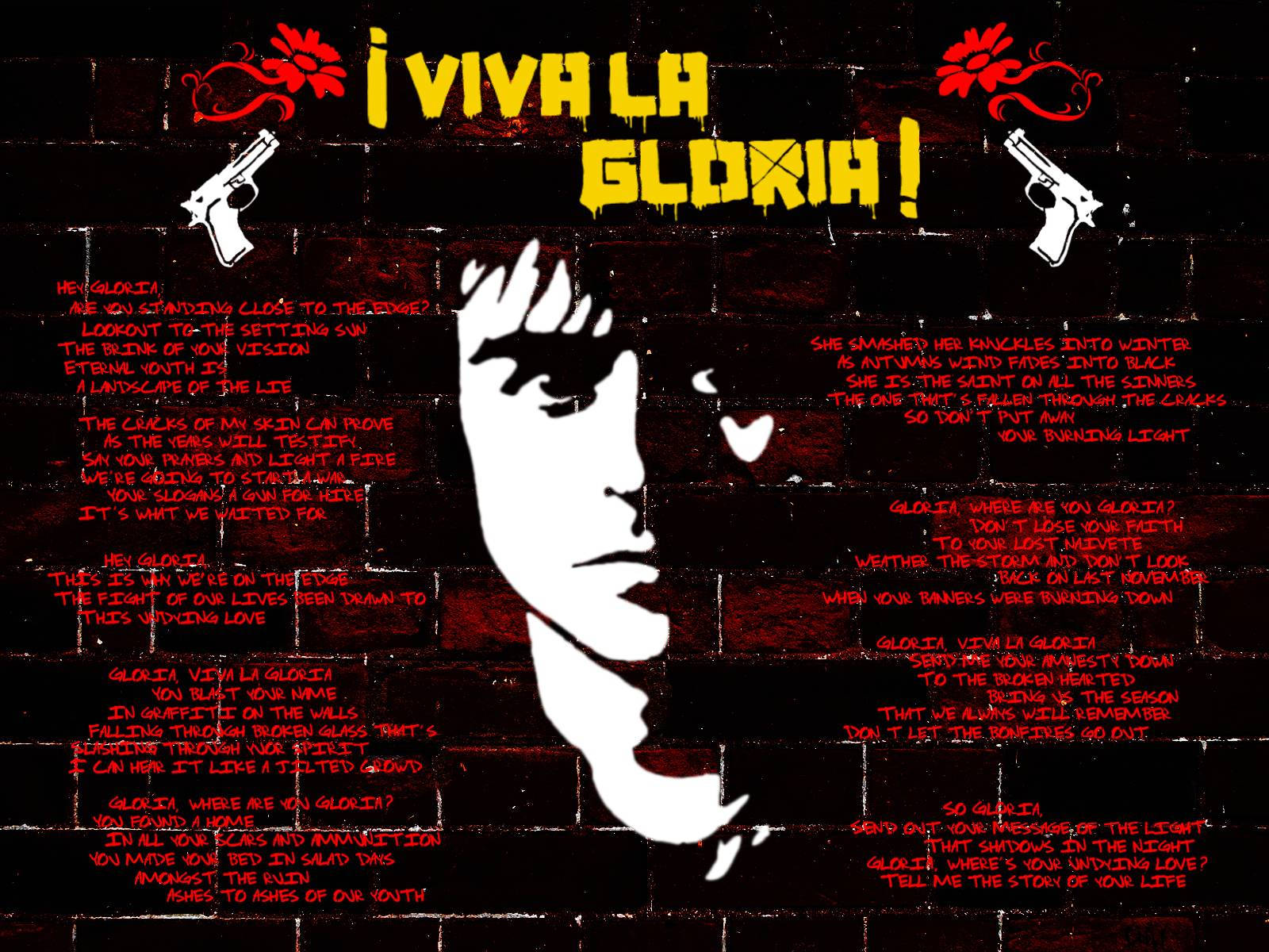 綠日樂隊《Viva La Gloria》歌詞藝術 壁紙 — 一幅粗糙的塗鴉壁畫在磚牆上展示了一個男人臉部的白色剪影，帶有紅色文字和兩把手槍，兩側是粗體黃色短語「¡VIVA LA GLORIA!」
