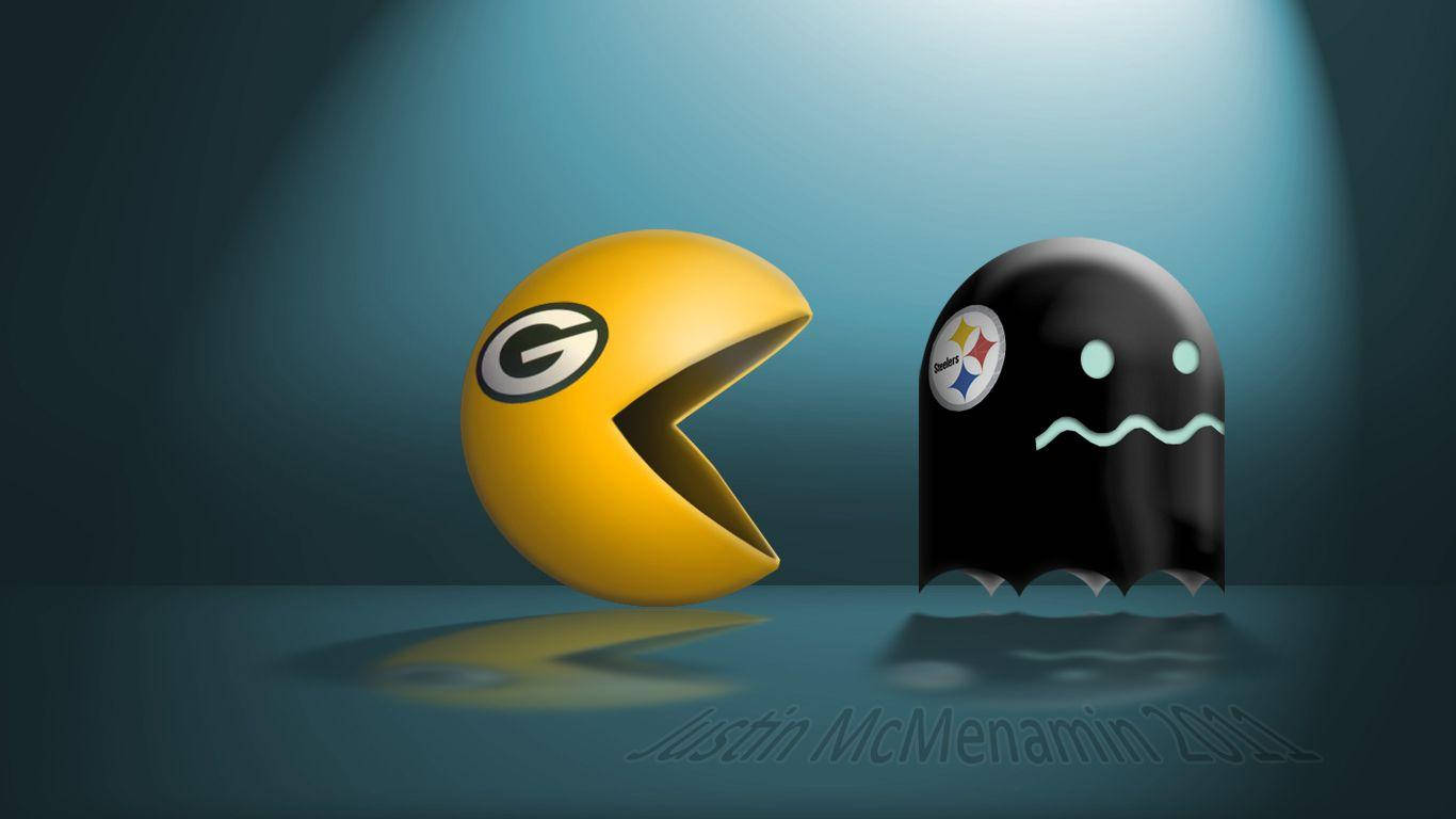 黃色 Pacman 和黑色鬼魂帶有 NFL 球隊標誌在聚光燈下對峙。