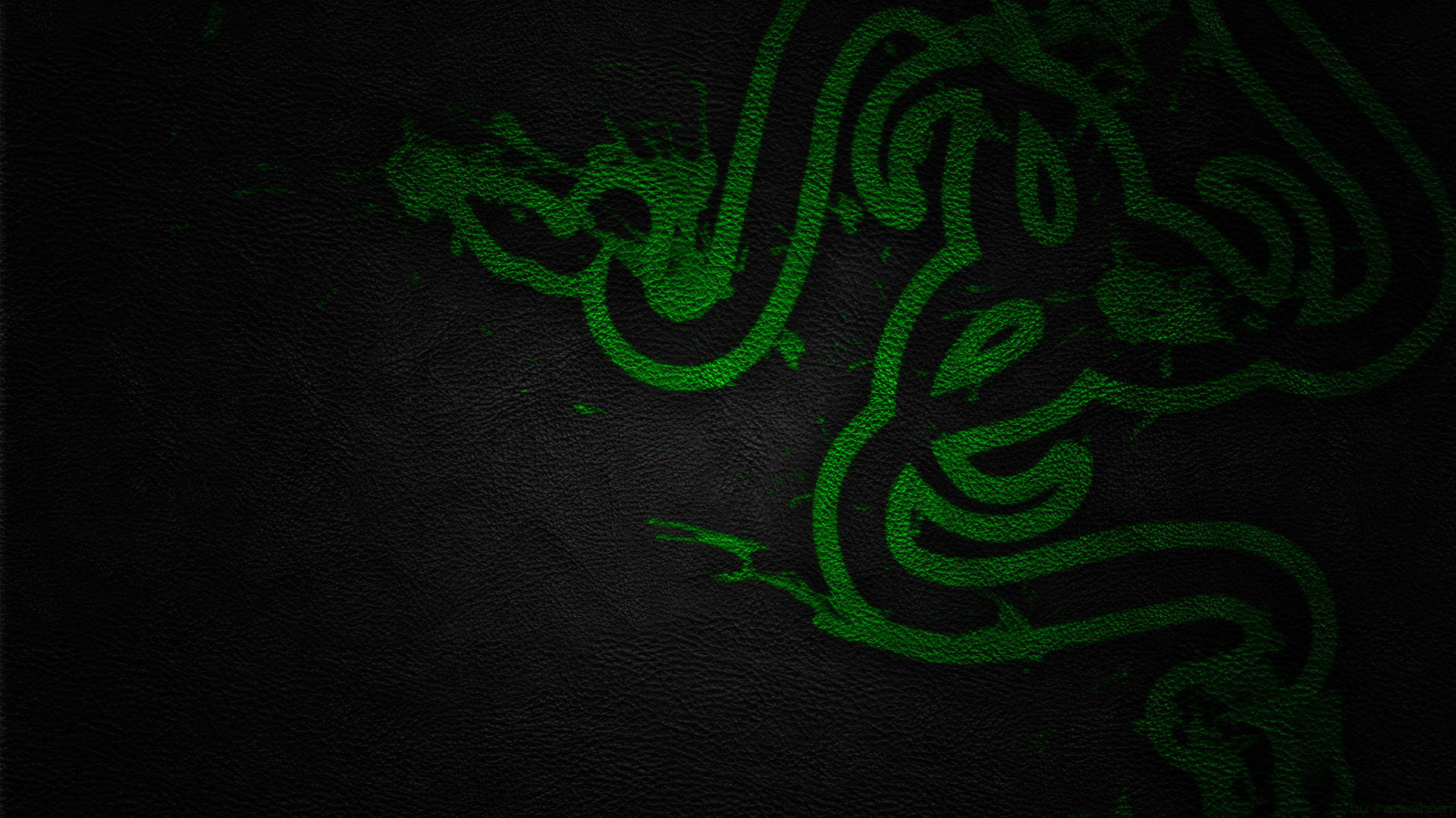 綠色Razer PC標誌 壁紙 — 發光綠色Razer標誌蝕刻在深色紋理皮革上，帶有微妙的燈光高光。