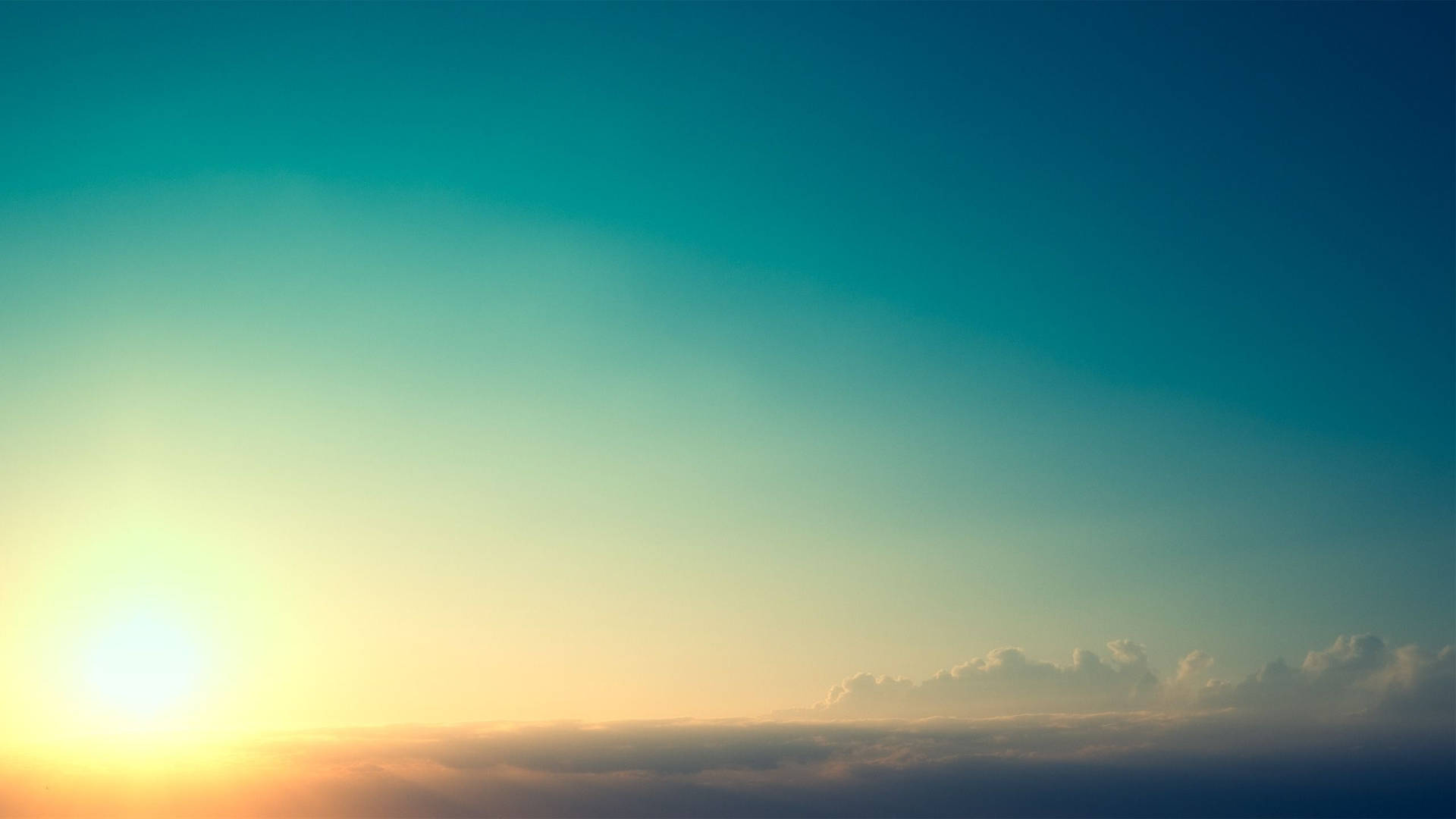 雲端上的日出，天空從金色漸變到藍綠色 — 綠色天空 壁紙