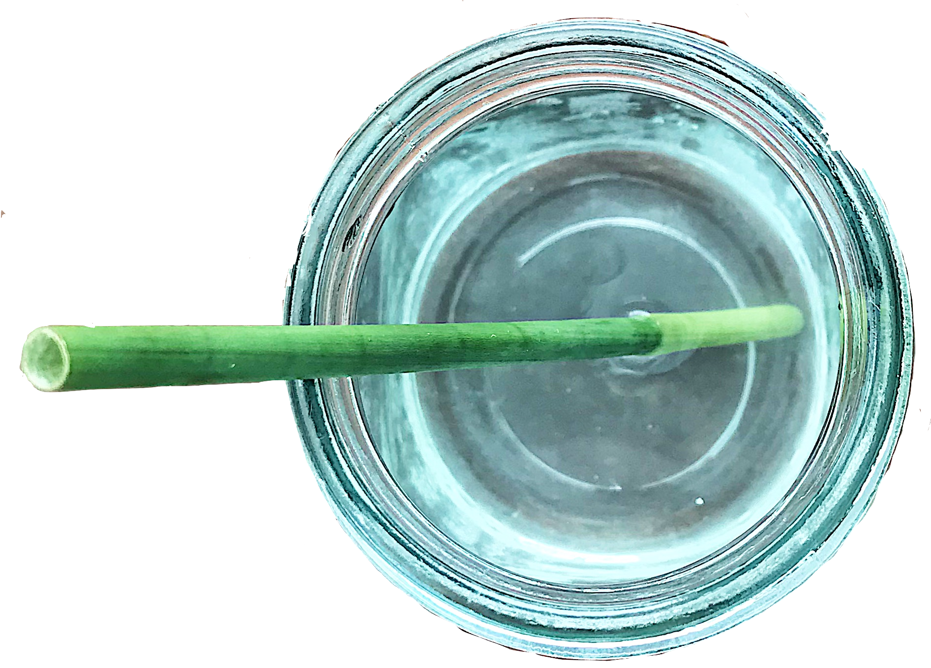 綠色植物纖維吸管 壁紙 — 從上方俯瞰，一個綠色飲管漂浮在裝滿水的透明玻璃罐中，背景為黑色。