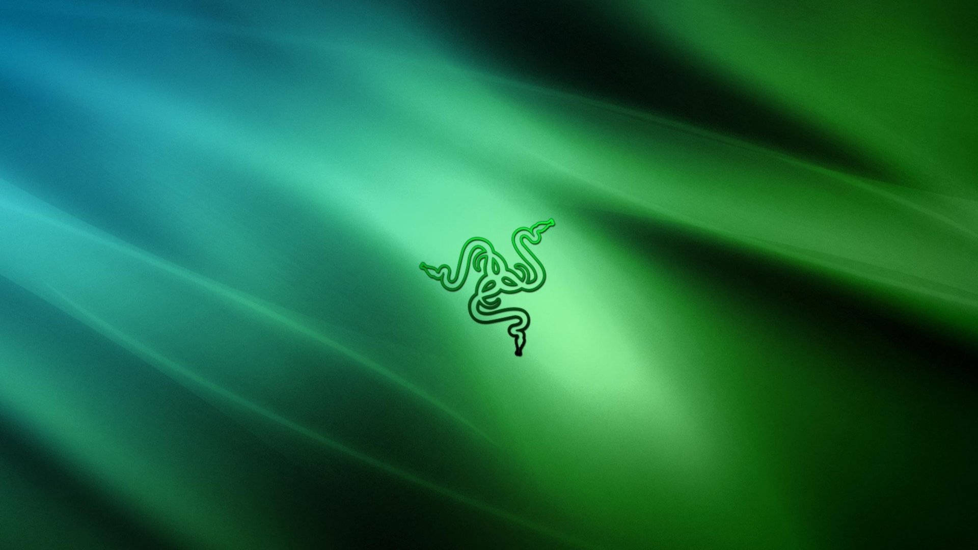 綠色漸變背景的 Razer PC 標誌 壁紙 — 發光的綠色Razer標誌居中在青綠色和深綠色的漸變背景上，帶有流動的光線條紋。