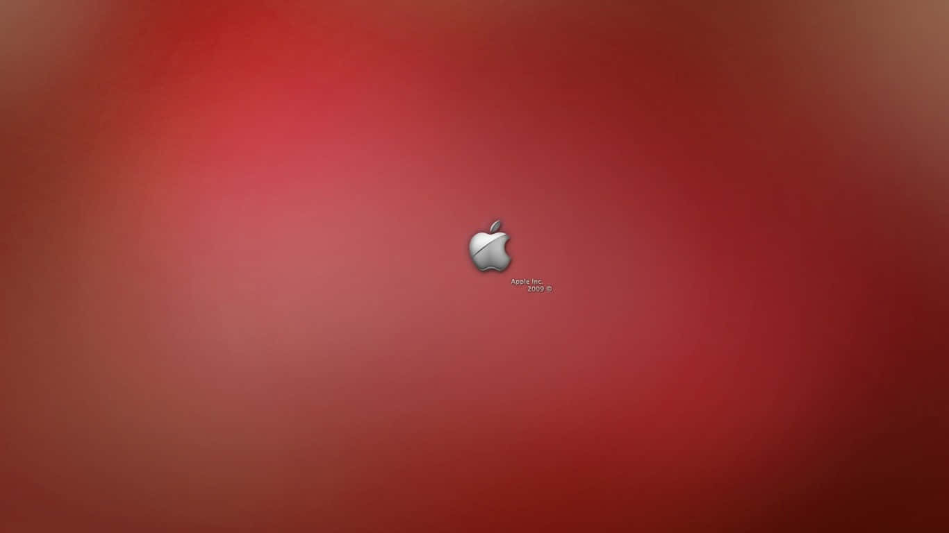 綠色背景上的蘋果標誌 壁紙 — 一個時尚的銀色Apple標誌，居中放置在帶有柔和照明的漸變紅色背景上。