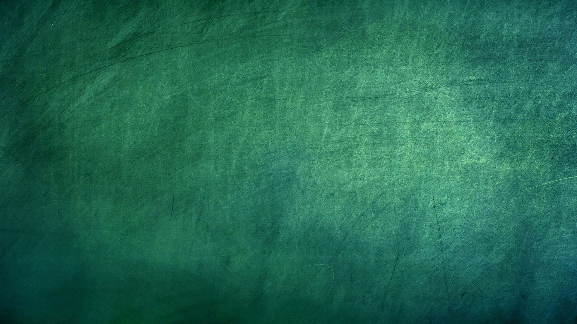 帶有刮痕和漸變照明的磨損青綠色紋理表面。