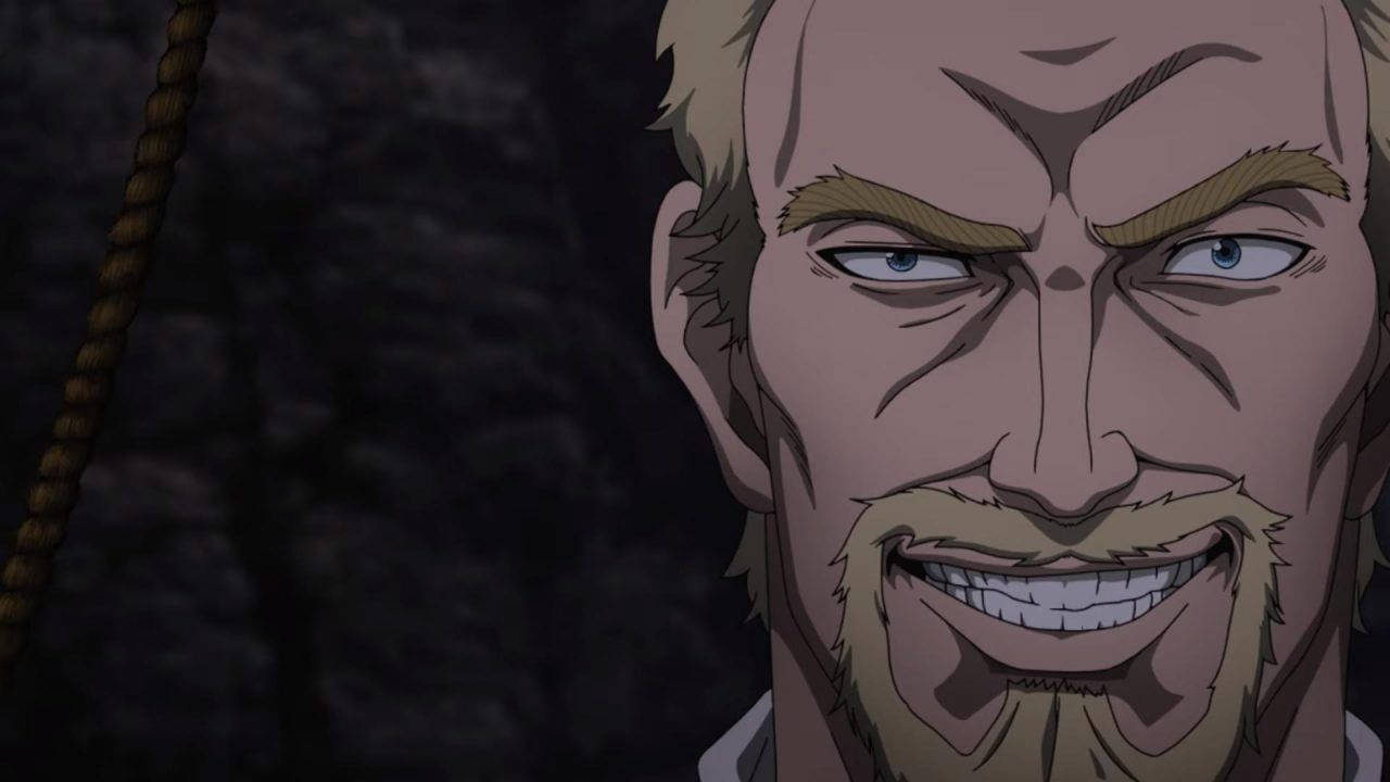 動漫男人金髮鬍鬚在黑暗岩石環境中強烈咧嘴笑。