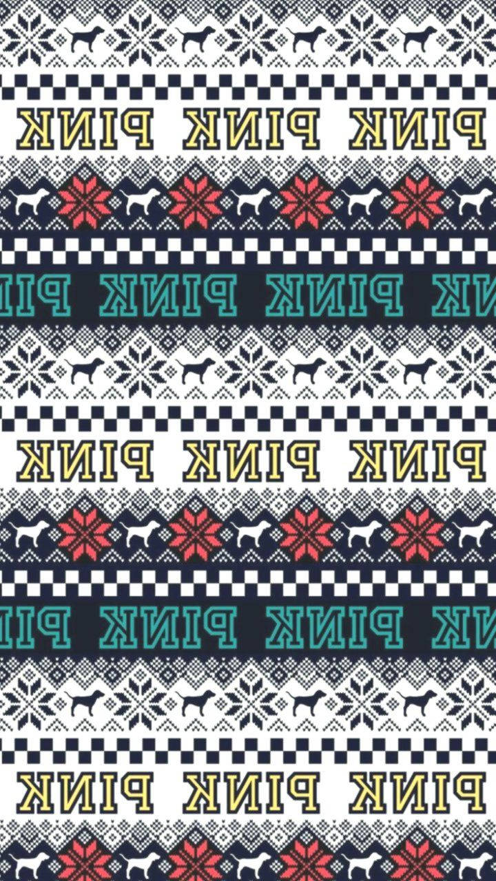 維多利亞的秘密聖誕節圖案 壁紙 — 在深色背景上重複出現雪花、狗和文字的圖案，顏色鮮明。
