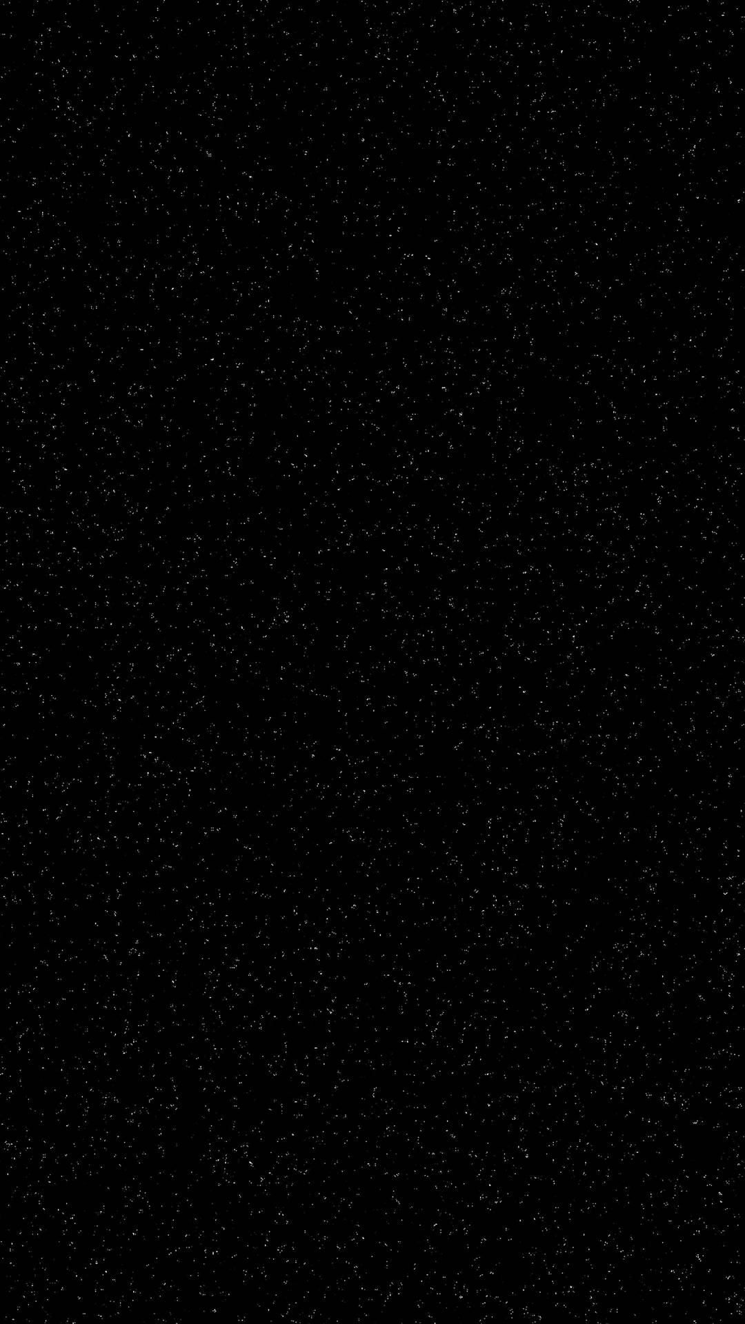 無盡的黑色空間點綴著細小的白色星星。