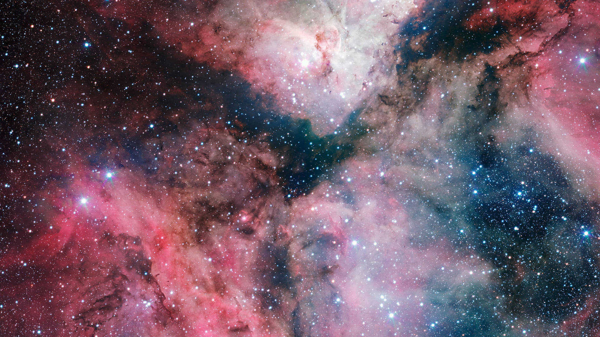 一個色彩繽紛的星雲，充滿了發光的星星和宇宙塵埃雲，在深空中。