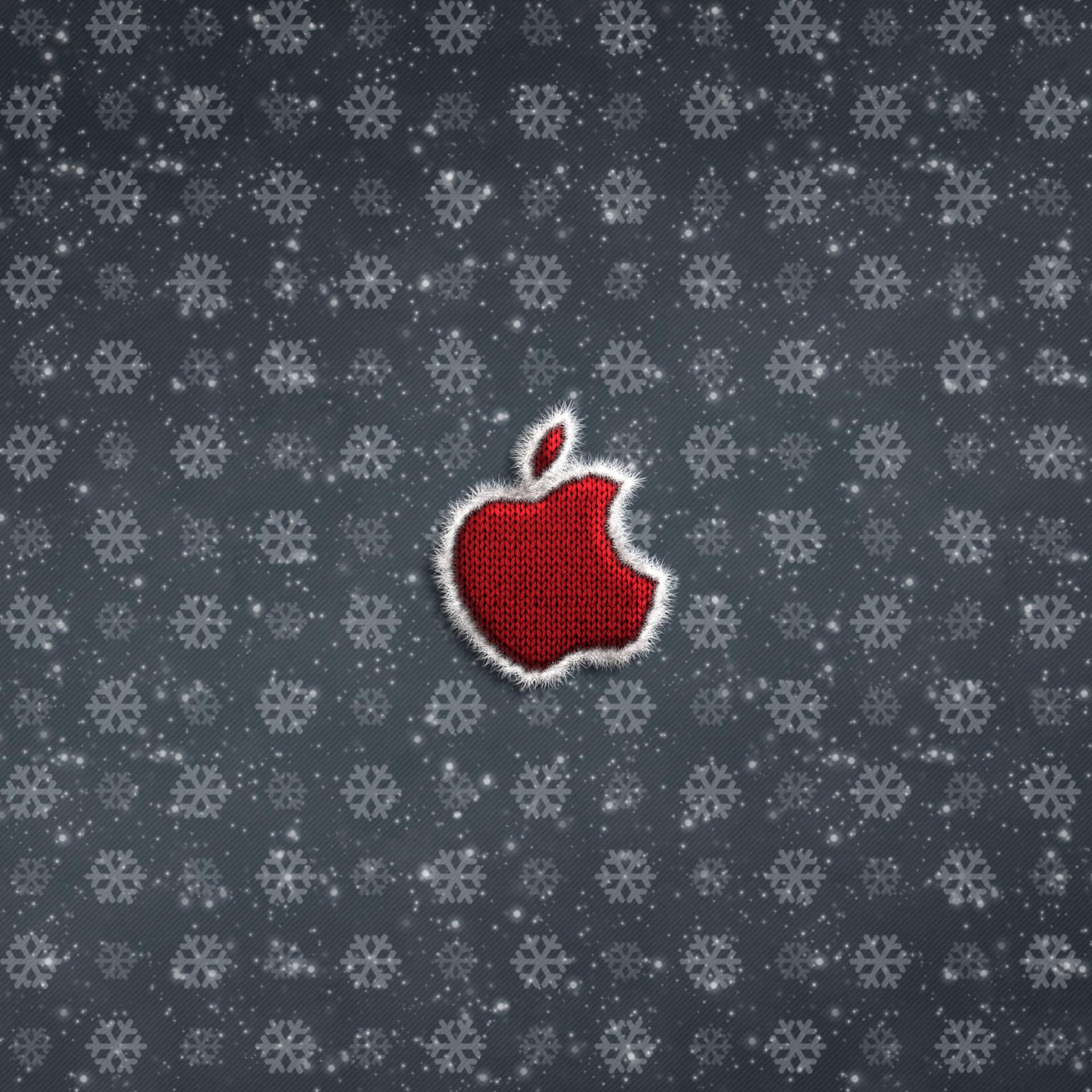 紅色編織Apple標誌，帶白色流蘇，在雪灰色背景上。
