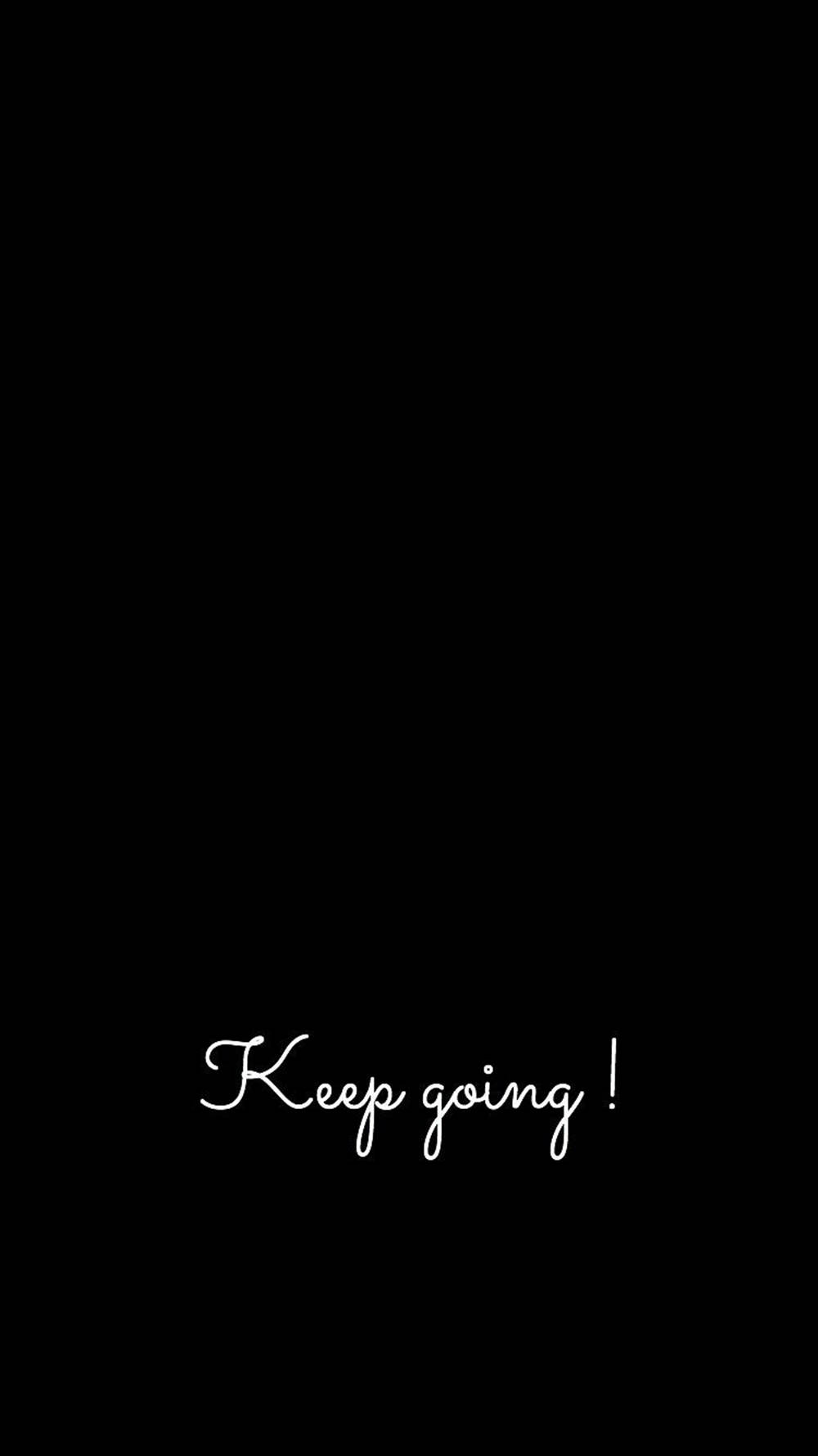 勵志名言 Keep going! 白色草書在黑色背景上