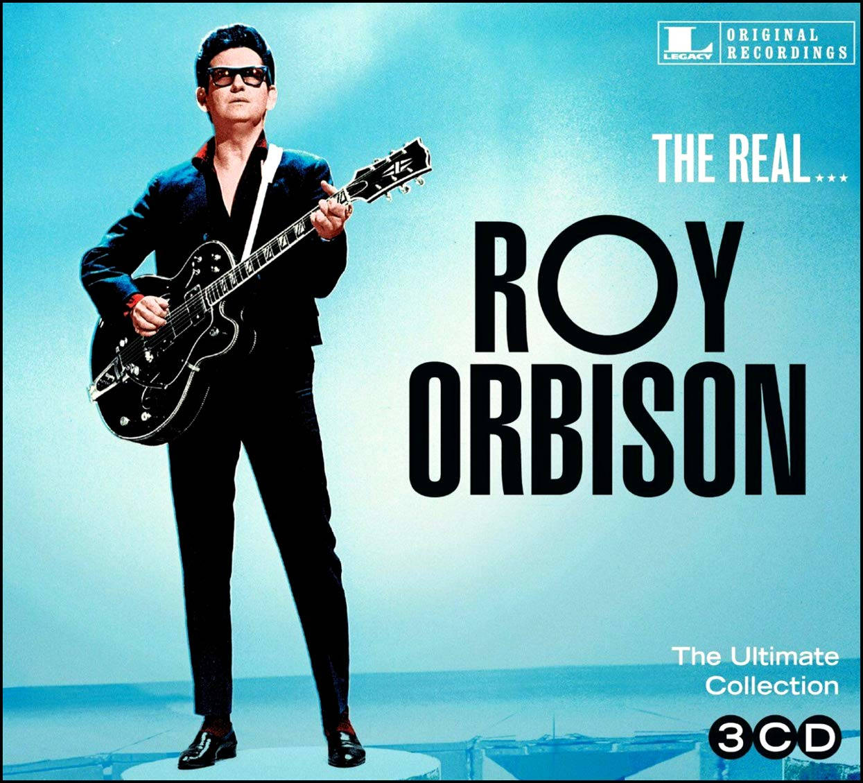 Roy Orbison 身穿黑色西裝和太陽眼鏡，在藍色專輯封面上手持結他。