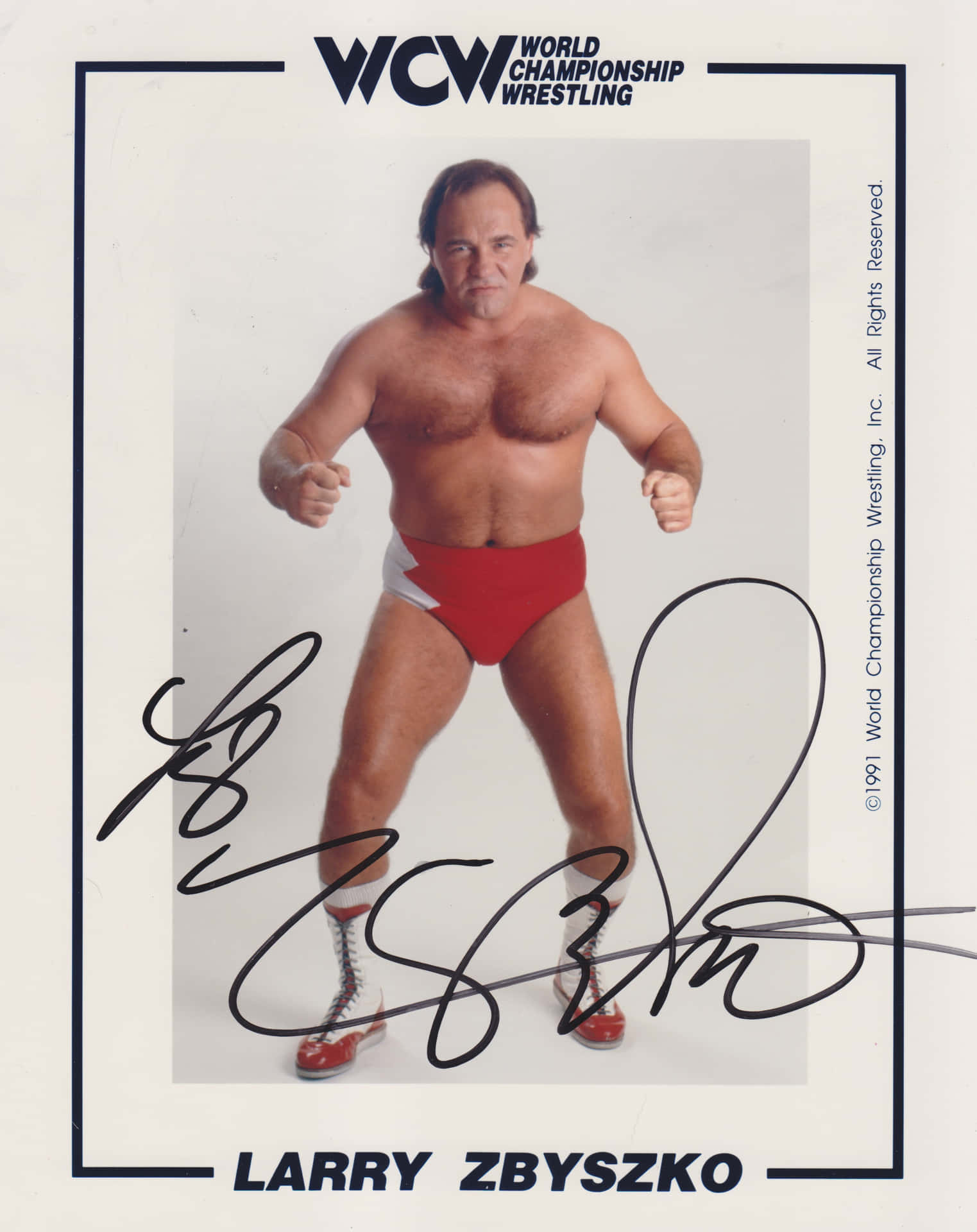 摔角手 Larry Zbyszko 穿著 WCW 摔角服裝的簽名照片。
