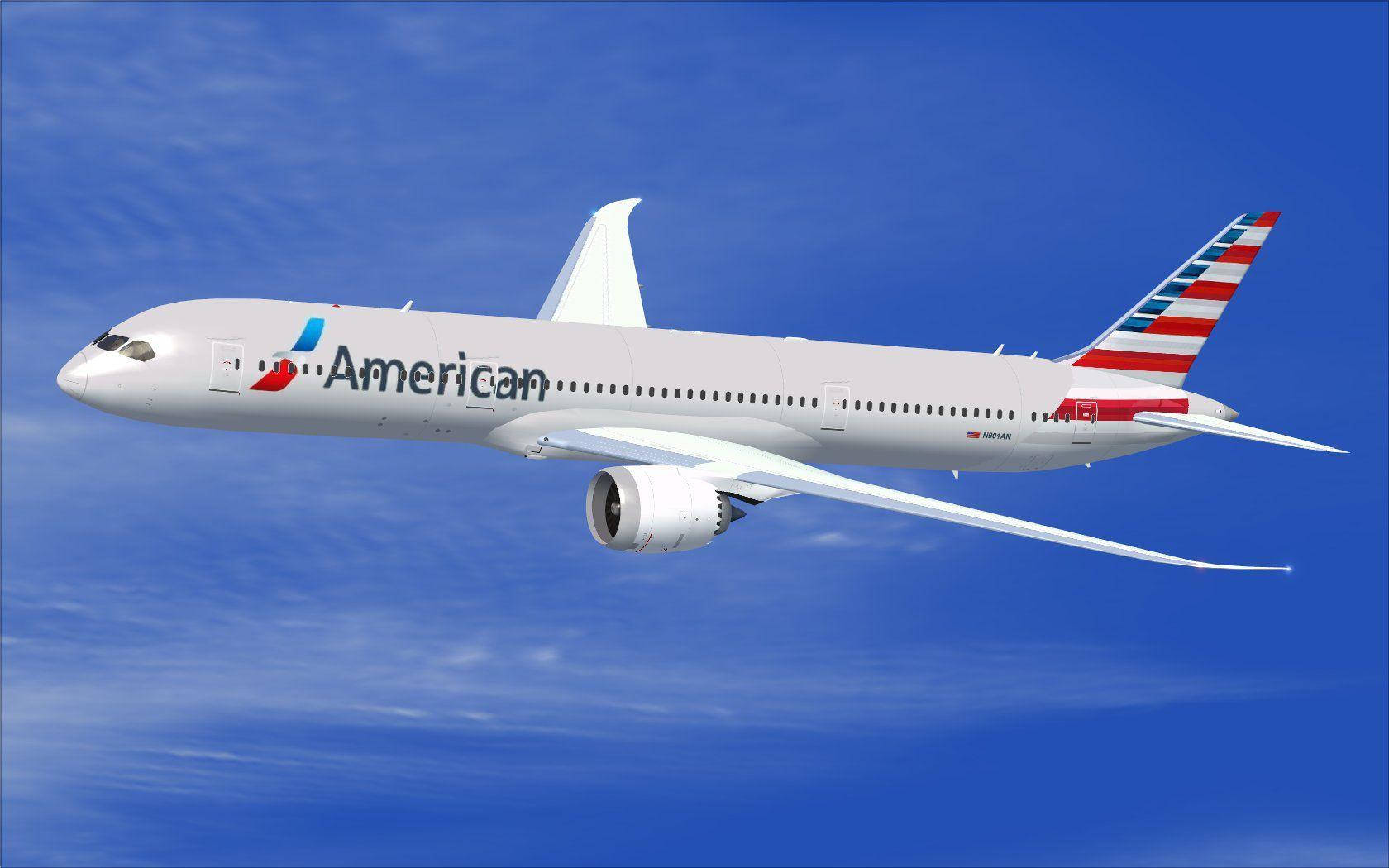 美國航空商用飛機 壁紙 — 一架白色的美國航空波音787夢幻客機在晴朗藍天中優雅翱翔，伴隨著縷縷薄雲。
