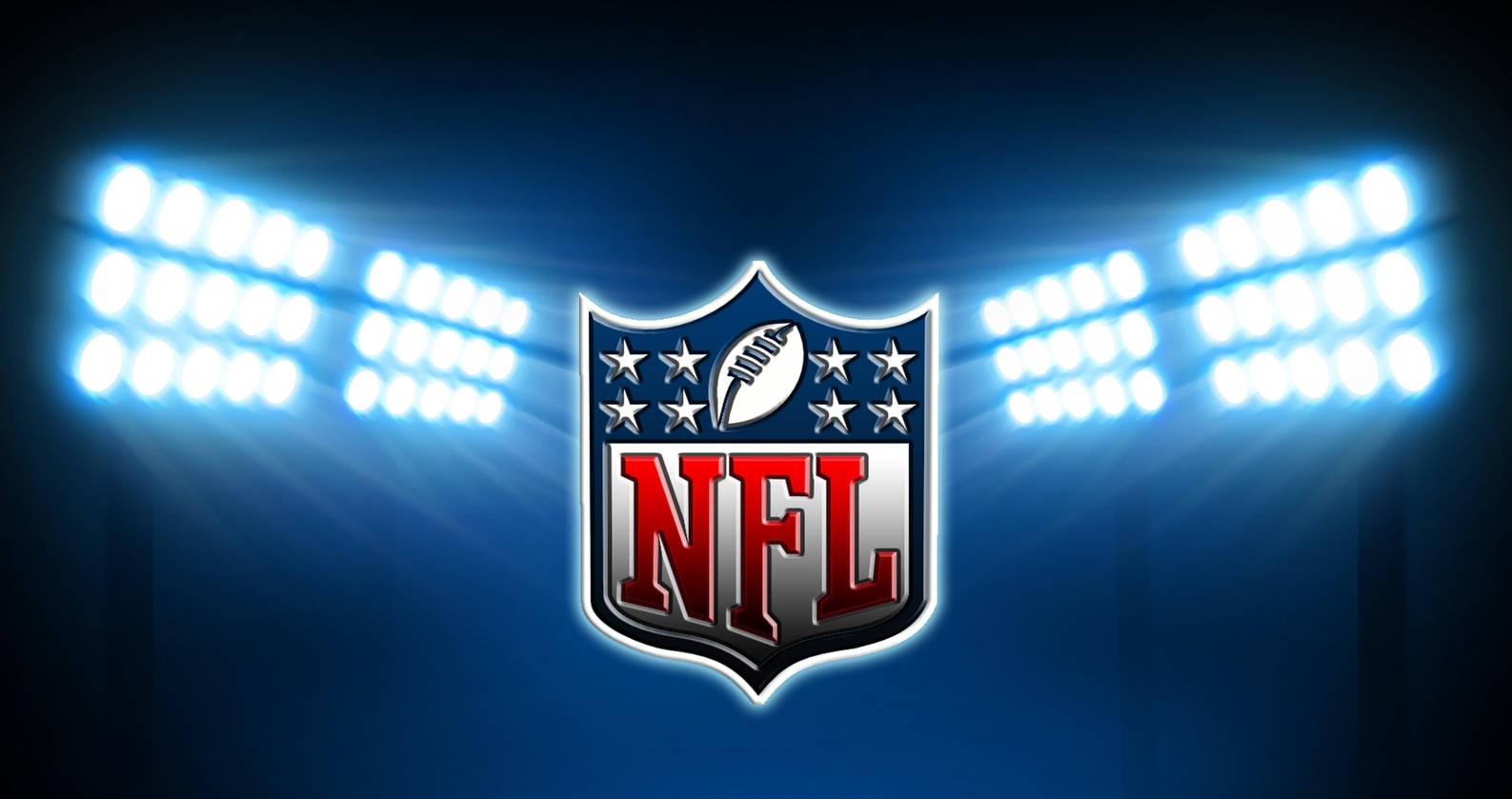 美國足球酷炫標誌 壁紙 — NFL標誌被明亮的體育場燈光照亮，背景是深藍色的夜空。