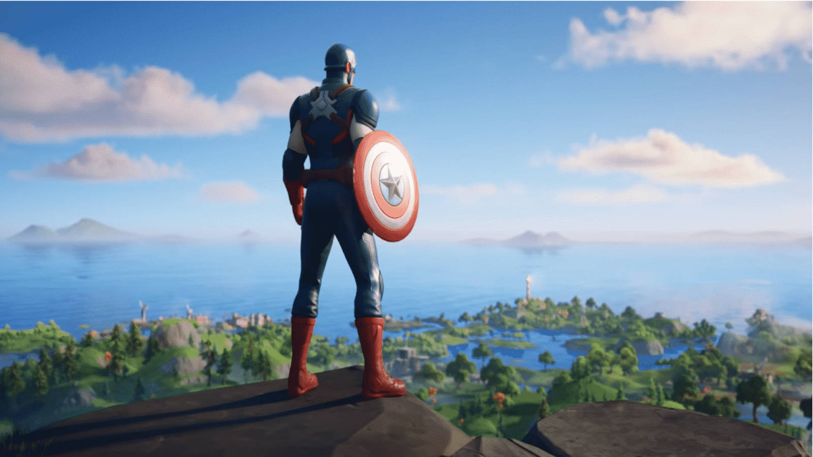 Fortnite 桌布 壁紙 — 美國隊長站在懸崖頂上，俯瞰著明亮藍天和蓬鬆雲朵下充滿活力的海岸景觀。