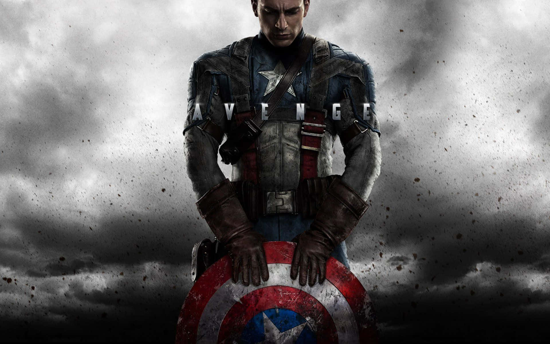 Best Captain America 桌布 壁紙 — 美國隊長莊嚴地舉著盾牌，背景是風暴般的灰色天空，胸前出現「AVENGE」字樣。