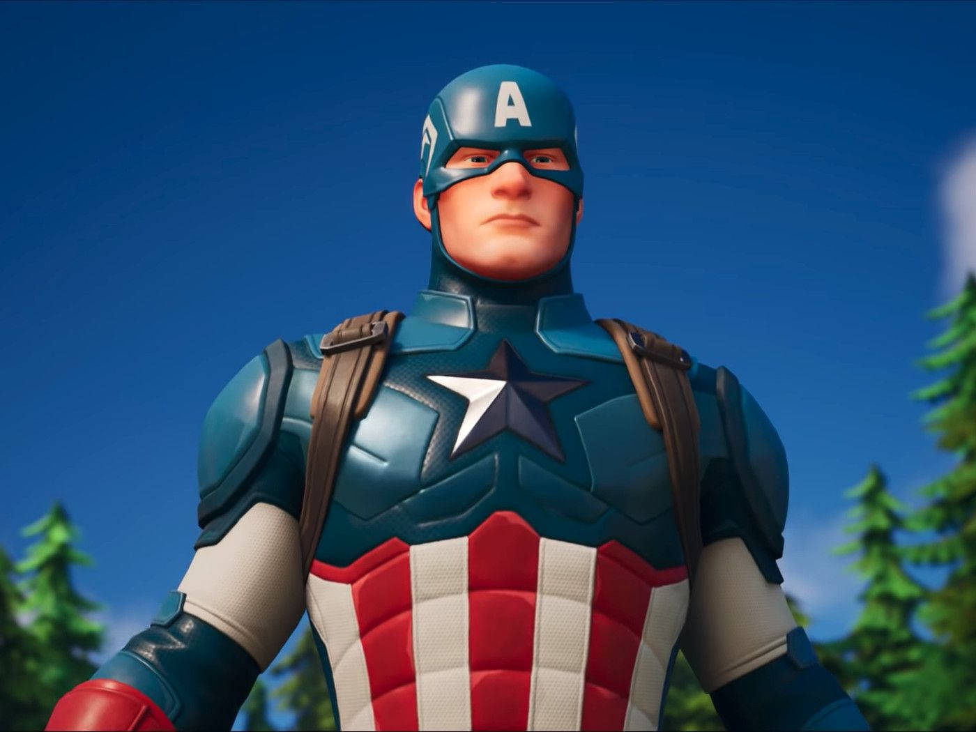 Fortnite 桌布 壁紙 — 美國隊長身穿標誌性的紅白藍戰衣，在藍天和松樹背景下傲然挺立。