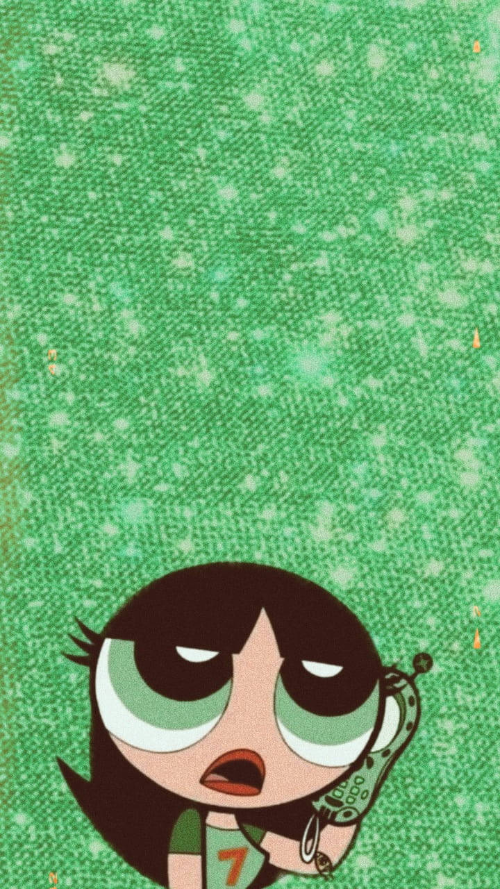 美學布特卡普小魔女 壁紙 — 一個卡通女孩，有著綠色大眼睛和一部手機，抬頭看著帶有白色斑點的紋理綠色背景。