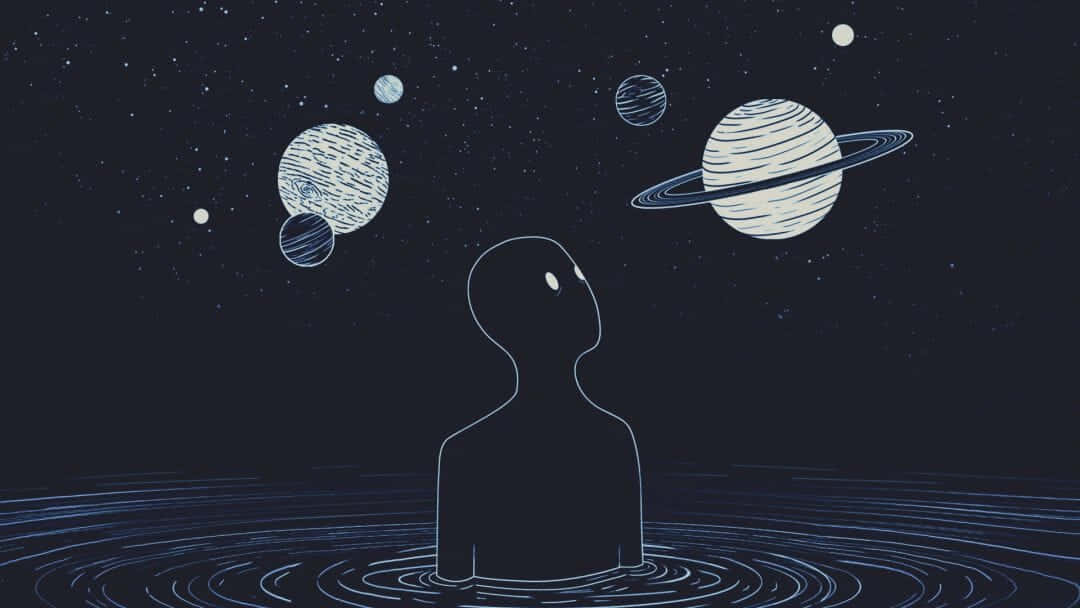 水中人物的剪影仰望漂浮的行星和星星。