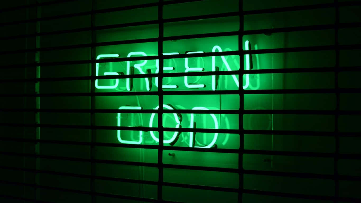 深色水平條後方，一個寫著 GREEN GOD 的綠色霓虹燈牌（夜間）。