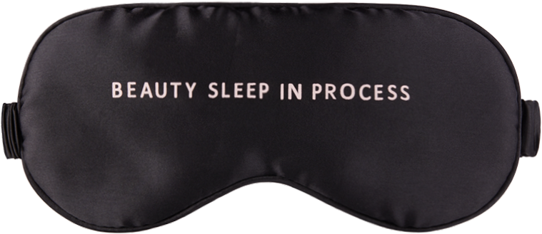 美容睡眠眼罩 壁紙 — 時尚黑色緞面睡眠眼罩，帶有白色文字beauty sleep in process。