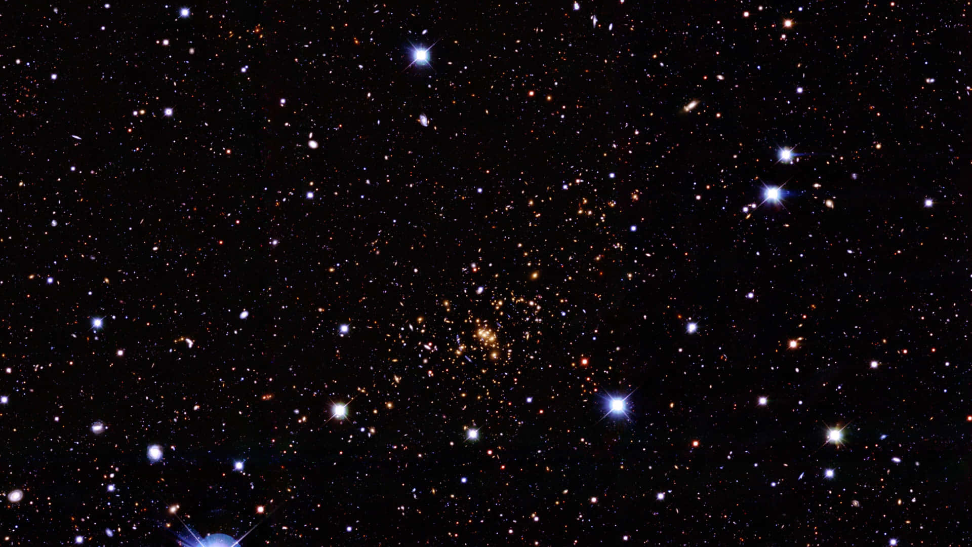 在黑暗夜空中閃耀的廣闊星場和星系。