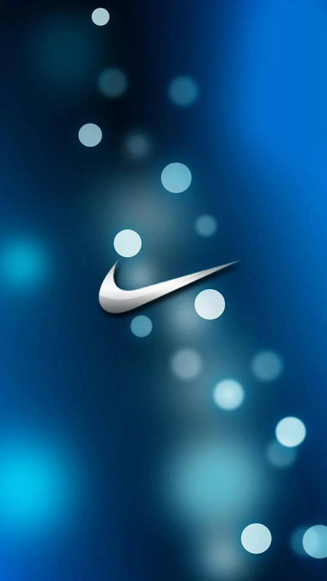 銀色Nike勾勾標誌，發光球體，藍色漸變背景