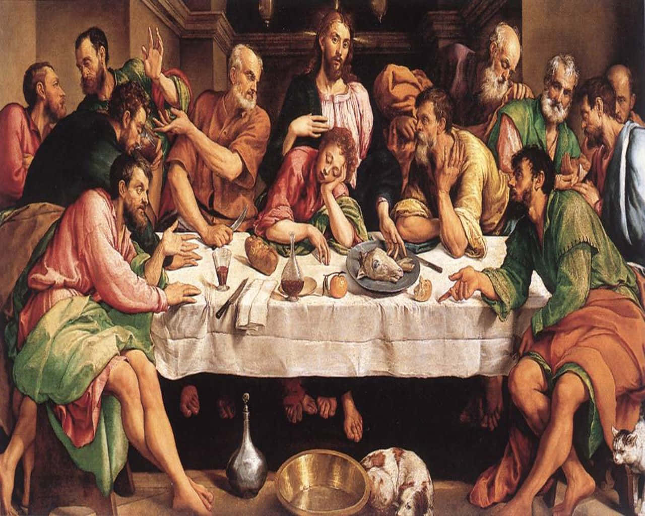 The Last Supper 桌布 壁紙 — 耶穌和祂的門徒在最後的晚餐期間，聚集在一個光線昏暗的房間裡的長桌旁，帶著富有表現力的手勢和多樣的情感。
