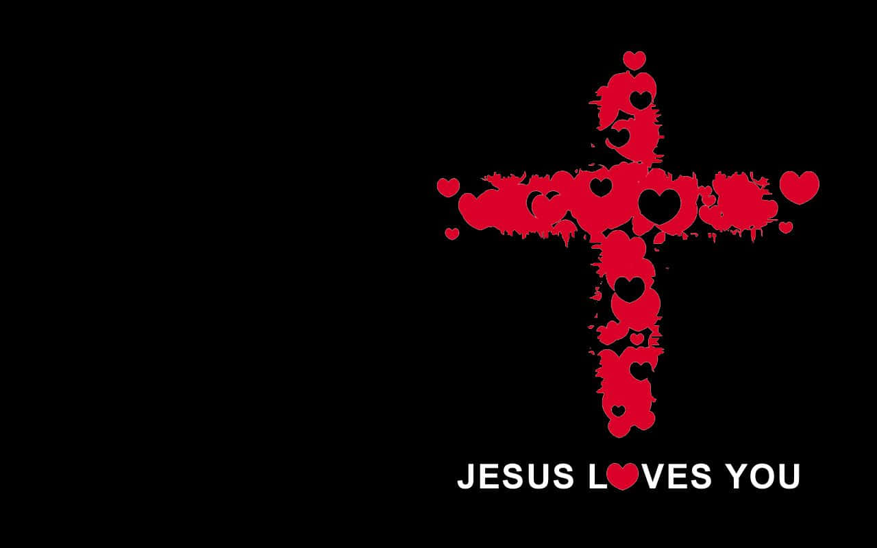 黑色背景上帶有文字 Jesus Loves You 的紅色心形十字架
