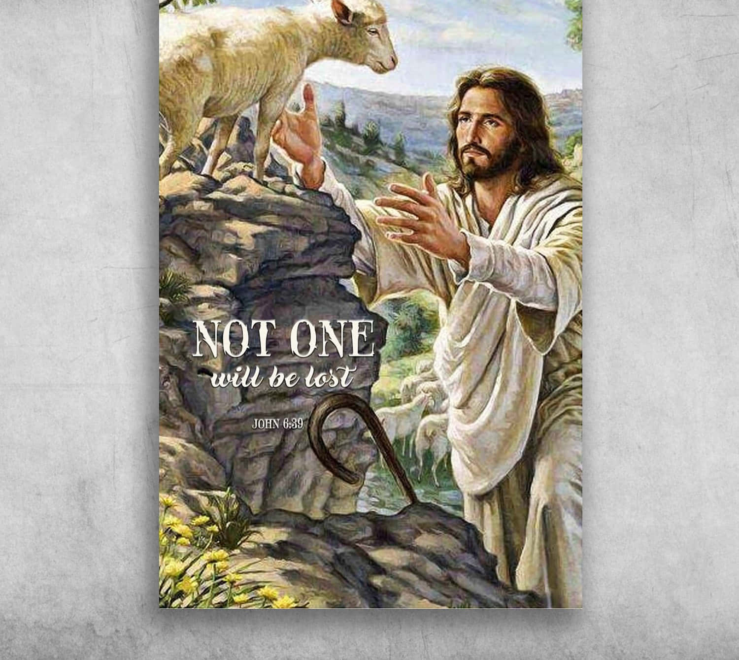 Jesus With Sheep 桌布 壁紙 — 耶穌溫柔地伸手觸摸一隻棲息在岩石懸崖上的羔羊，附近有牧羊人的杖，文字寫著『一個也不會失落』。