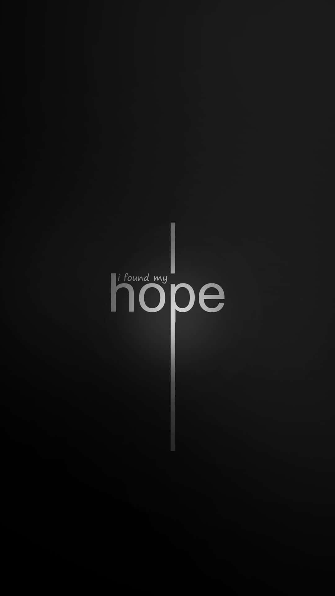 「聖地之美」 壁紙 — 簡約黑色背景上，白色文字「i found my hope」被一條垂直線（類似十字架）貫穿。
