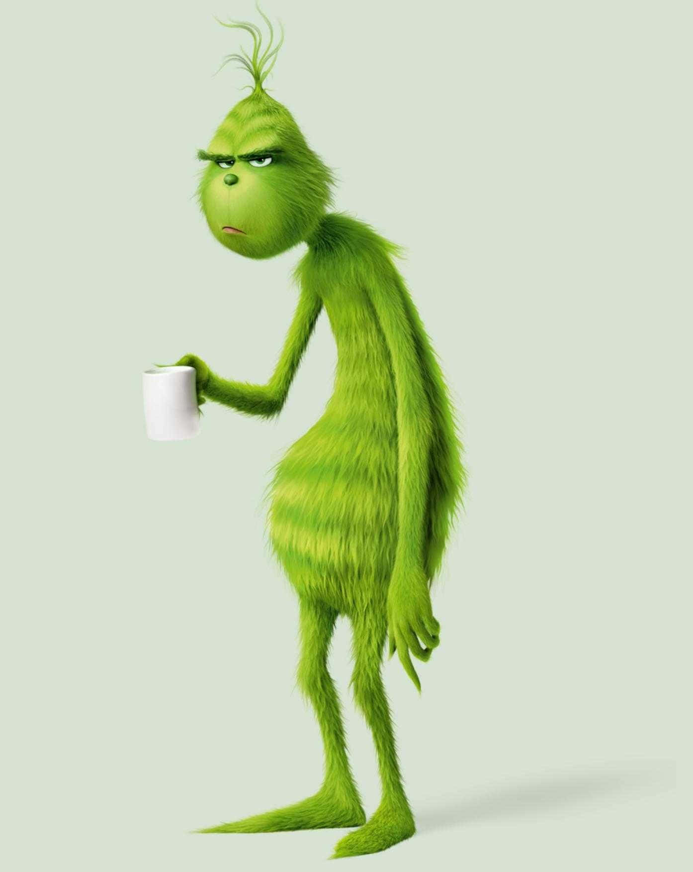聖誕怪傑手拿一杯咖啡 壁紙