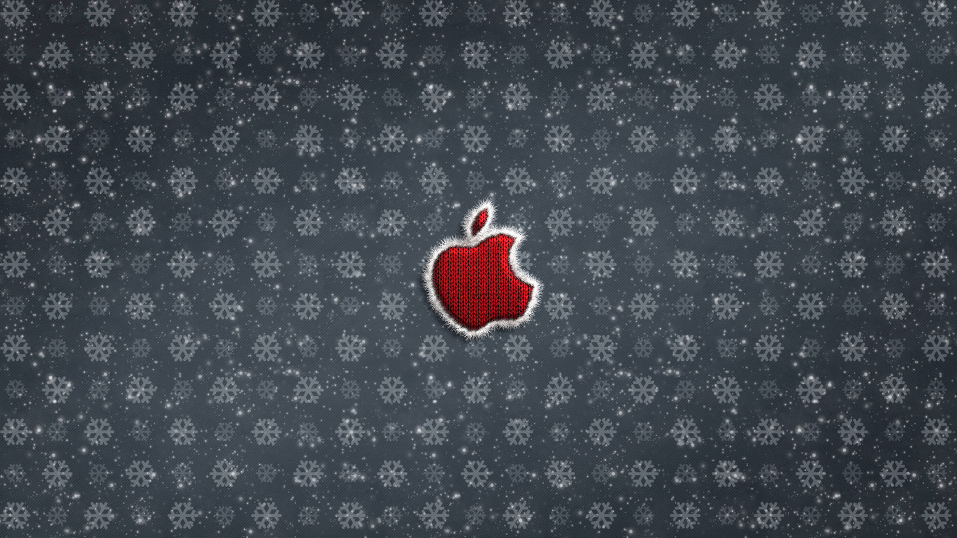 灰色雪花圖案背景上帶有白色縫線的紅色Apple標誌。