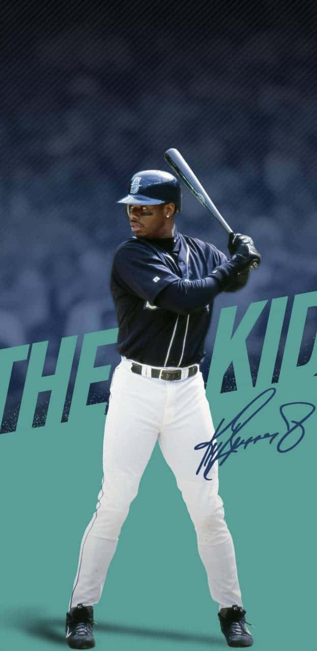 身穿海軍藍和白色球衣的棒球手處於打擊姿勢，帶有「THE KID」文字和簽名。