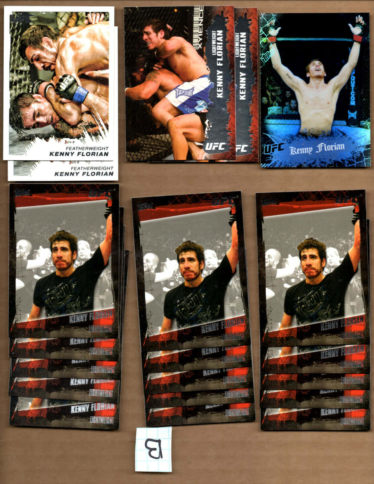 一堆Kenny Florian UFC收藏卡，顯示戰鬥場景和勝利姿勢。