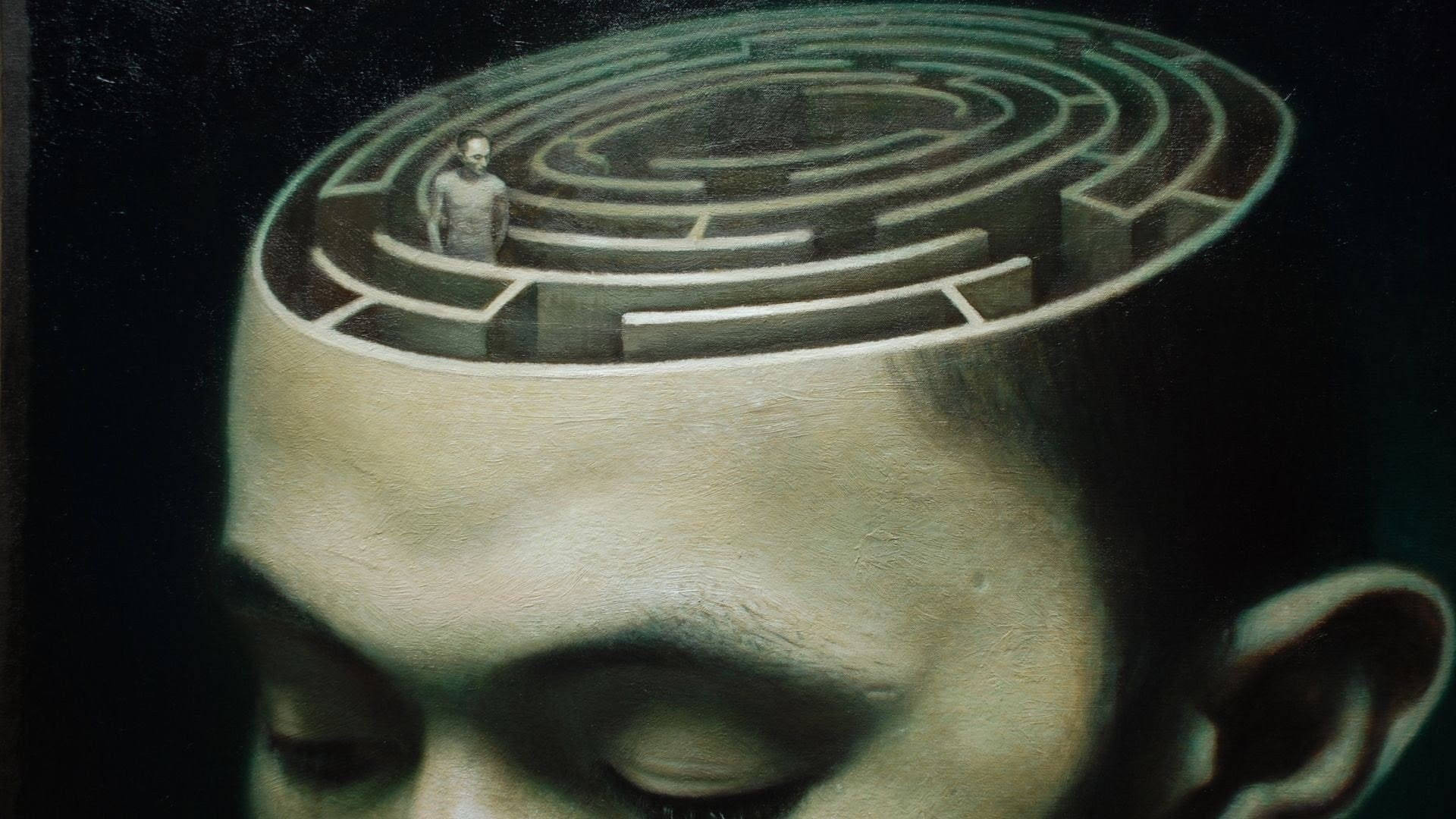 男人頭部的特寫，內部有一個迷宮，象徵內心的想法和困惑。